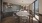 a kitchen with a table and chairs and a big window
