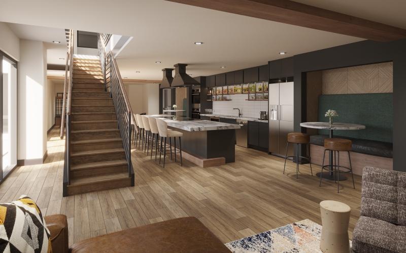 a large kitchen with a staircase in the clubhouse