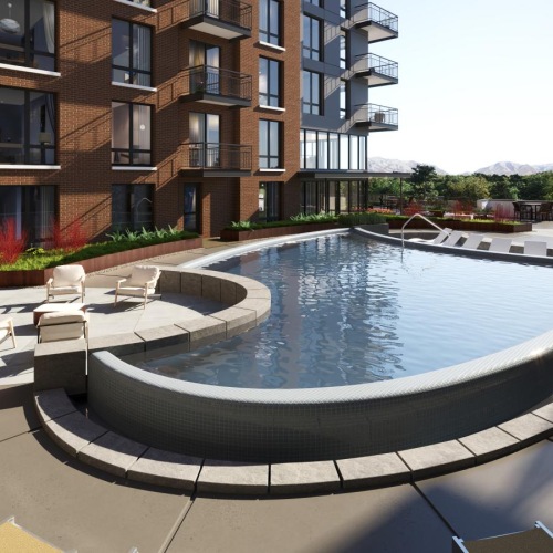 Relax and unwind poolside a swimming pool outside a building