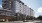 a building with cars parked in front
