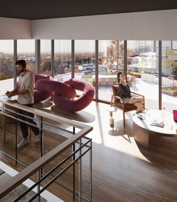 Montaire Student Living Apartments Three people work and relax in a modern, sunlit lounge with large windows and contemporary furniture.