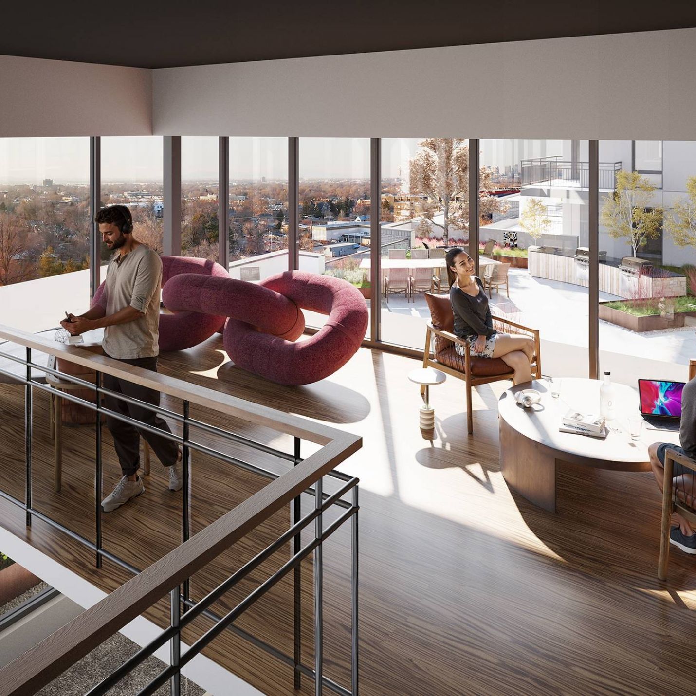 Montaire Student Living Apartments Three people work and relax in a modern, sunlit lounge with large windows and contemporary furniture.