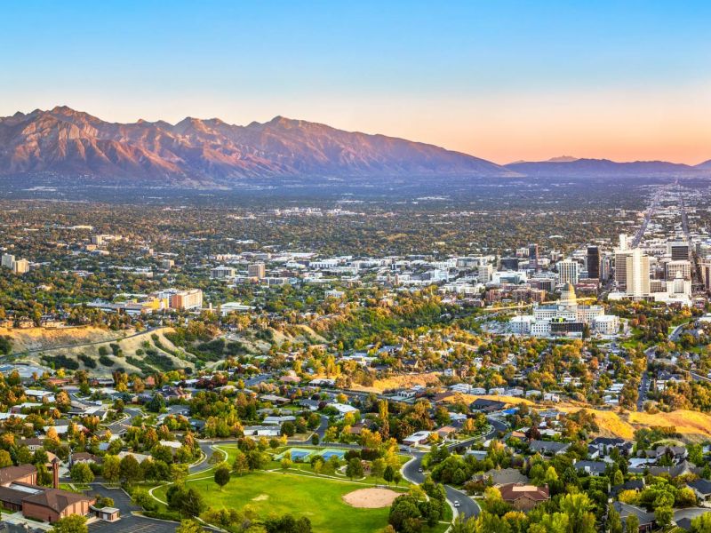 Montaire Student Living Apartments Aerial view of Salt Lake City with the Wasatch Mountains in the background during sunset.
