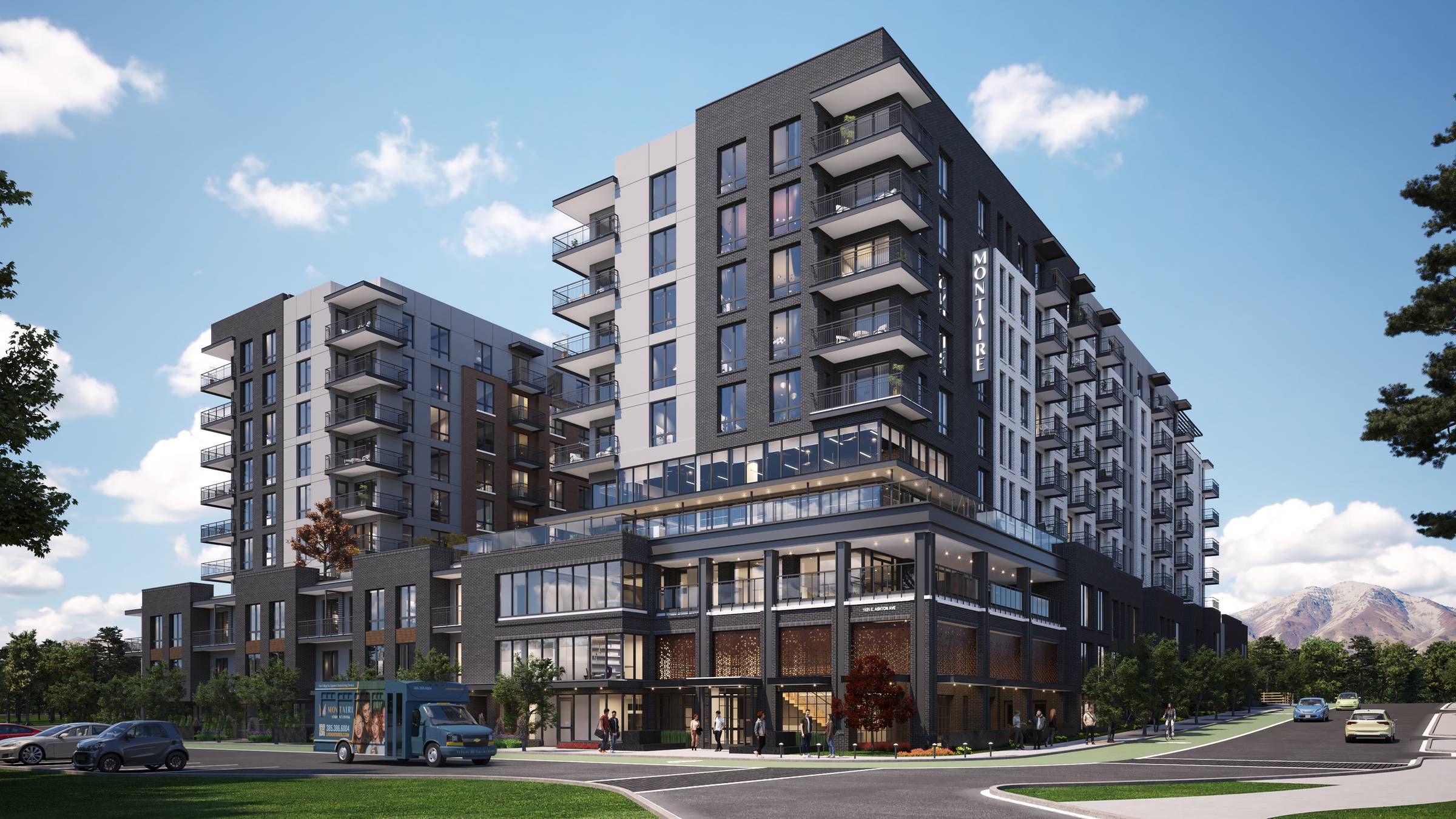 Montaire Student Living Apartments Modern multi-story apartment building with balconies, glass windows, and cars parked along the street out front.